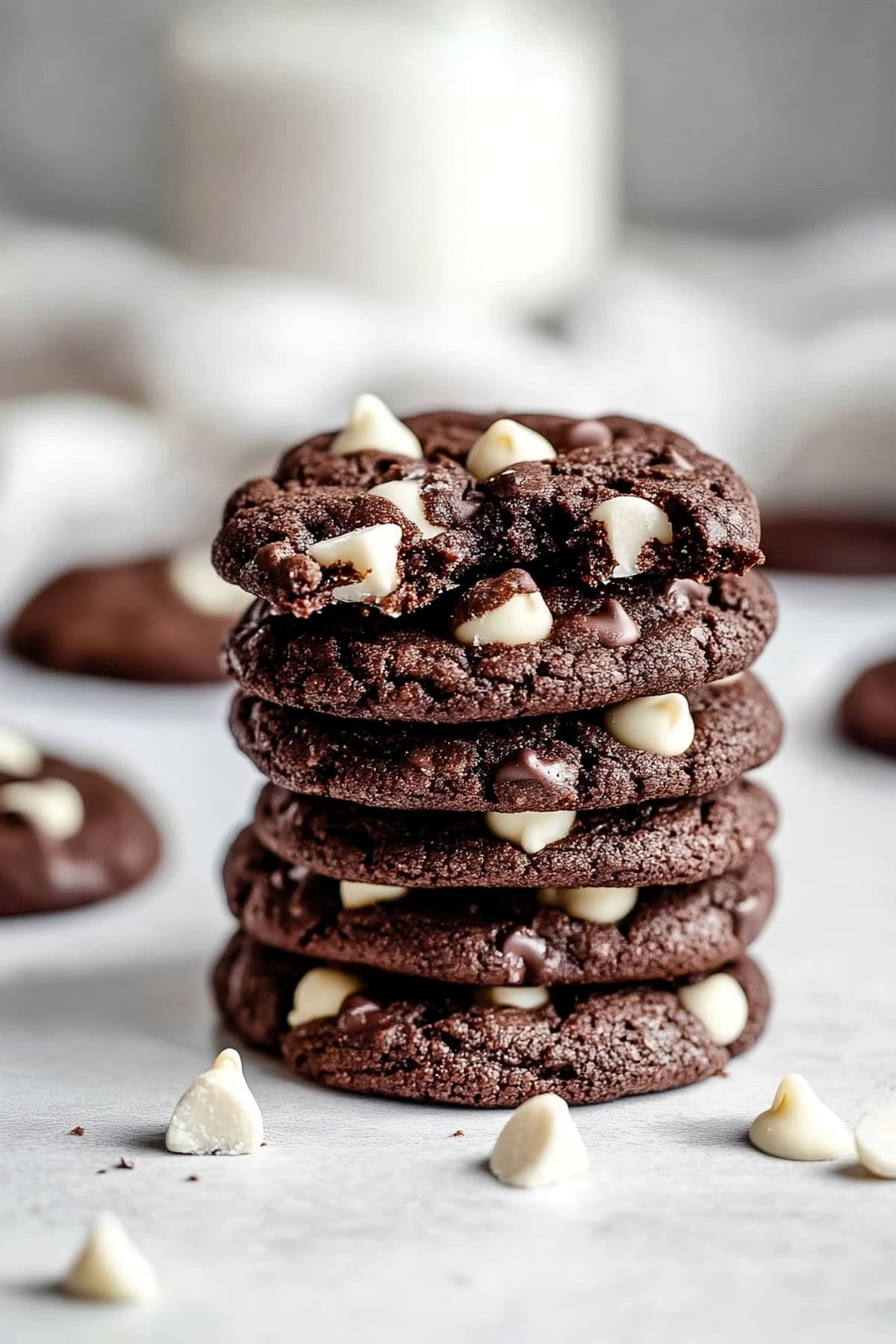 Stack of chocolate cookies with white chocolate chips, side view