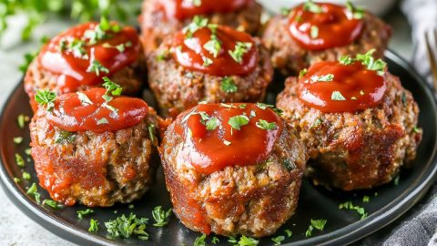 Mini meatloaf muffins on plate.