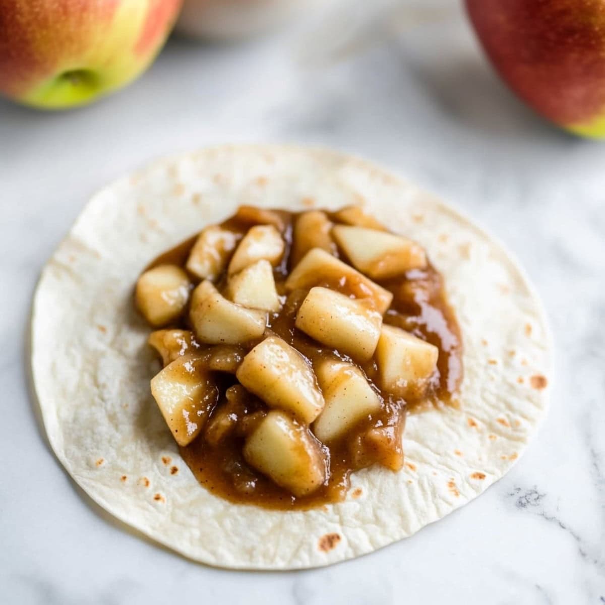 Apple filling in a flour tortilla.