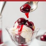 Cherries Jubilee with vanilla ice cream in a glass serving bowl