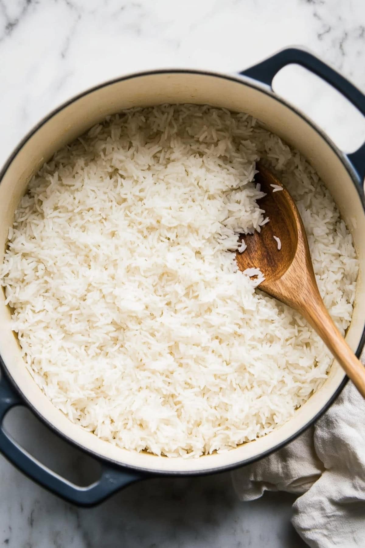 Jasmine coconut rice in a large pot, top view.