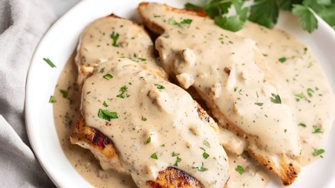 Cream cheese chicken served on a white plate.