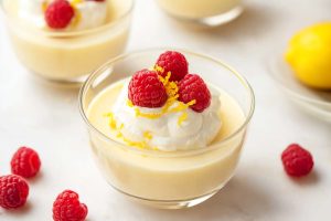 Close-up of homemade lemon pudding, showcasing its smooth surface and refreshing lemony color.