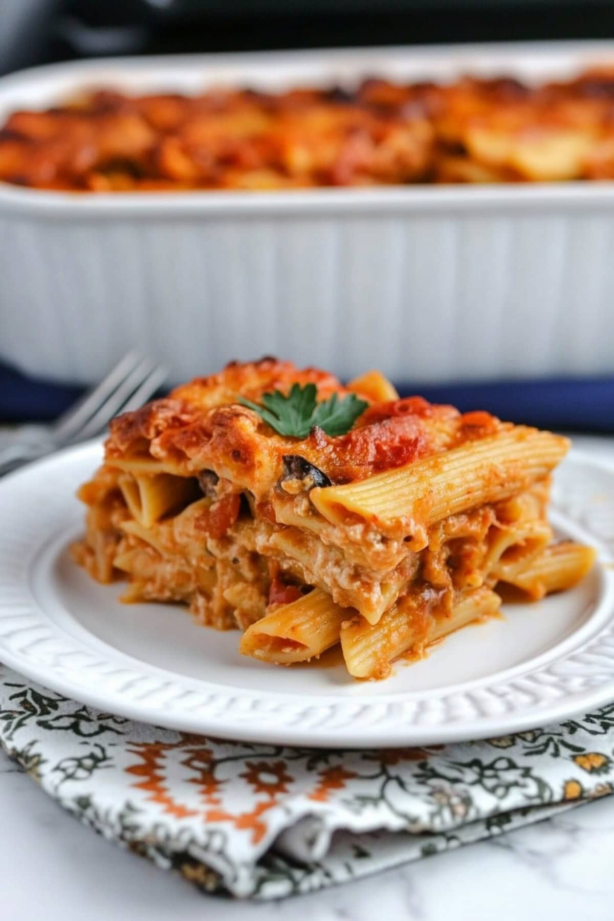 Layers of pasta, beef, and cheese in a Johnny Marzetti casserole, fresh out of the oven and ready to serve.