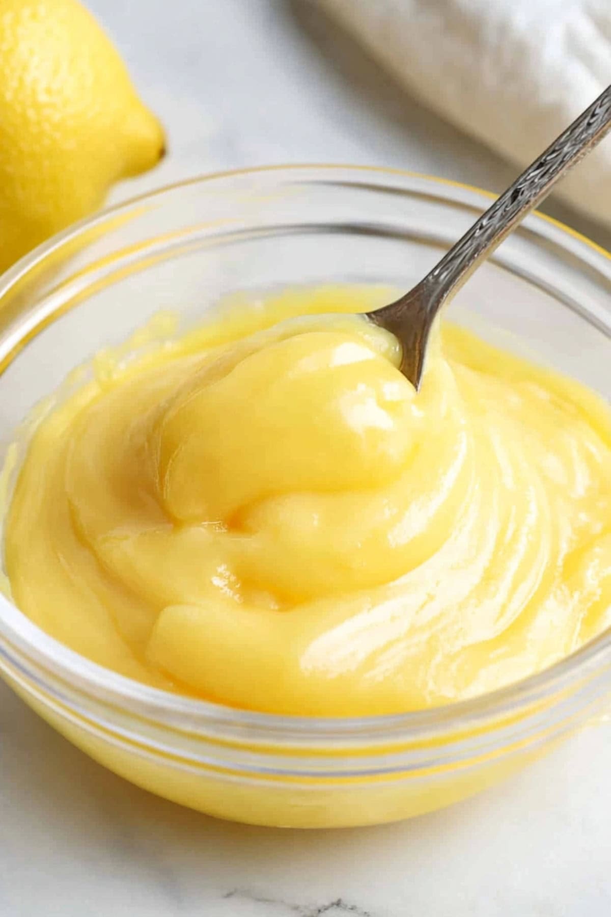 A glass bowl of lemon curd.