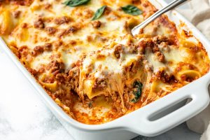 Sausage and cheese mixture with ravioli baked in a casserole.