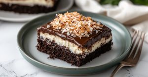 Mounds Candy Bars Cake slice on a plate