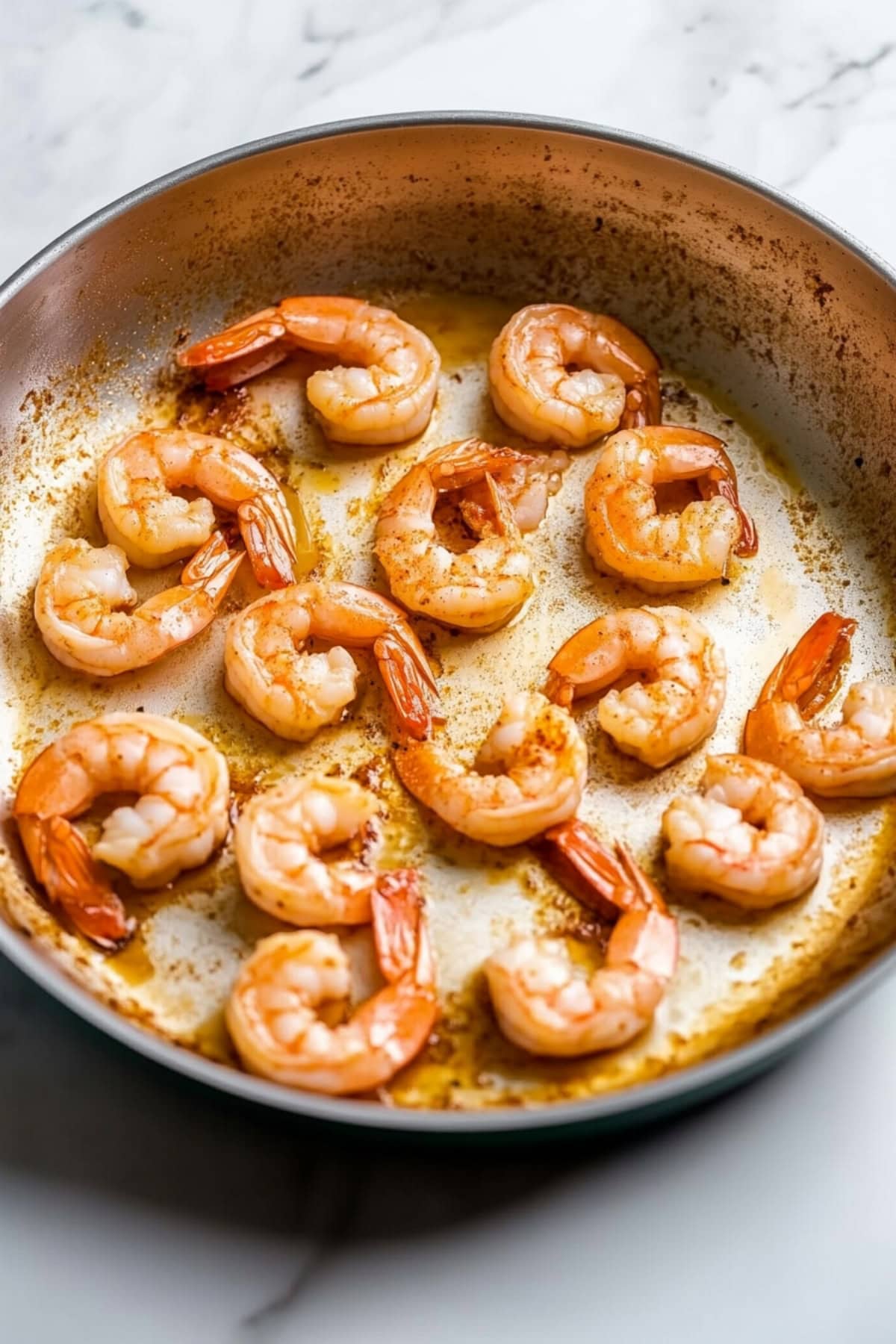 Cooked shrimp in a saucepan.