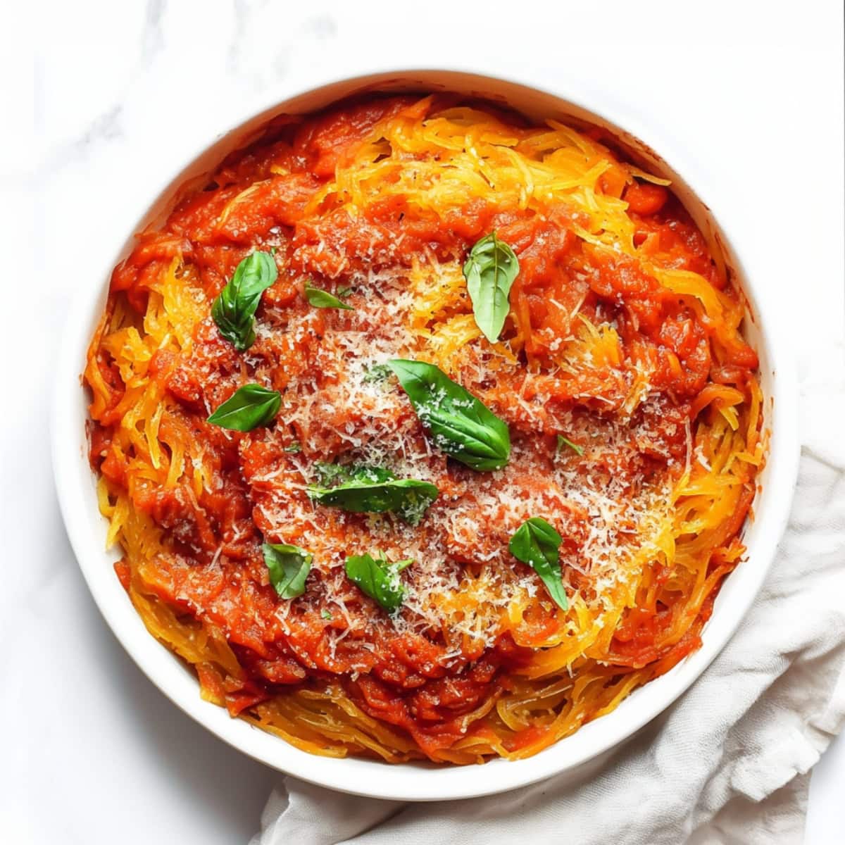 Spaghetti squash with marinara sauce in a bowl, overhead view