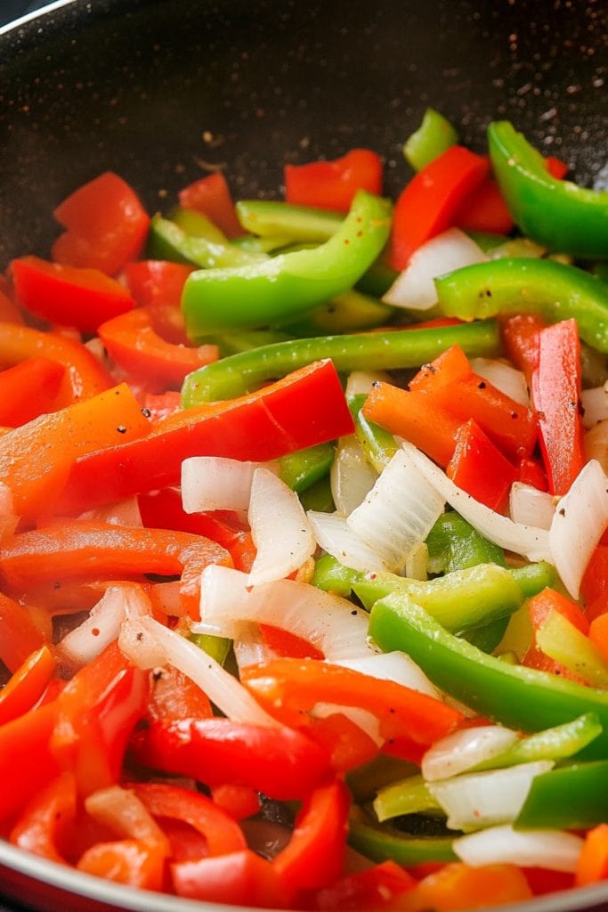 Red and Green Peppers with White Onions Stir Fry.