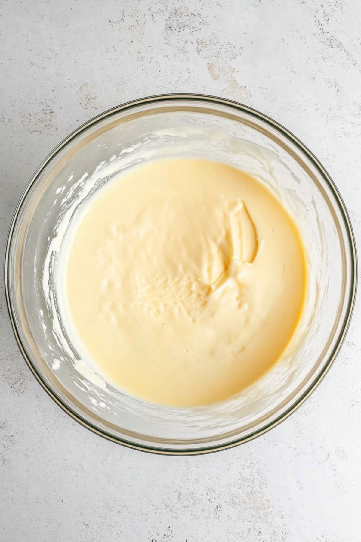 Cheesecake pudding in a glass bowl.