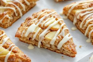 Apple cinnamon sugar drizzled with vanilla sugar arranged in a table with parchment paper.