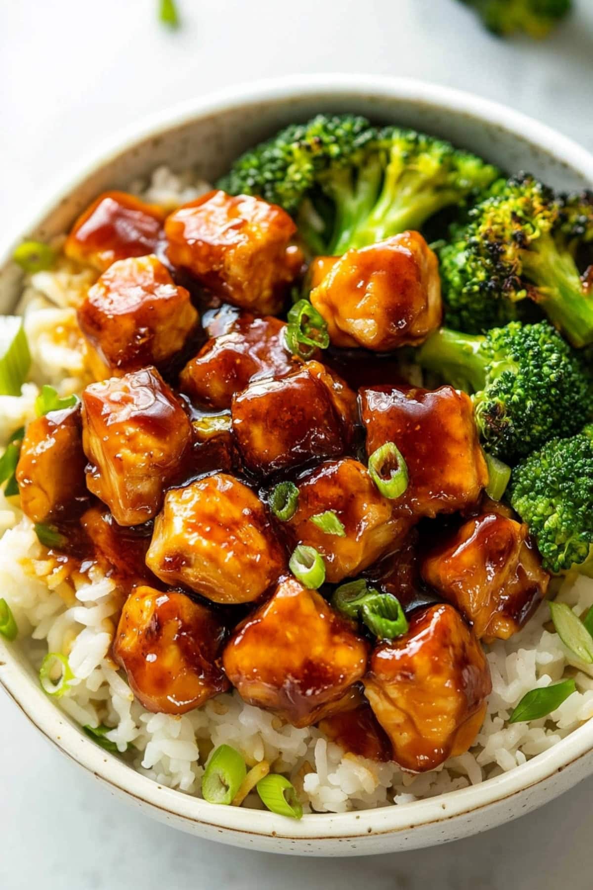 Apricot Chicken served with cooked white rice and pan-fried broccoli, top view