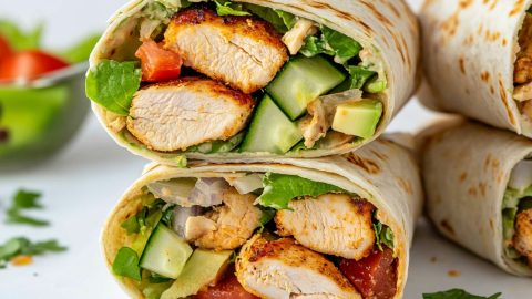 Soft tortilla wraps filled with grilled chicken, lettuce and tomatoes.
