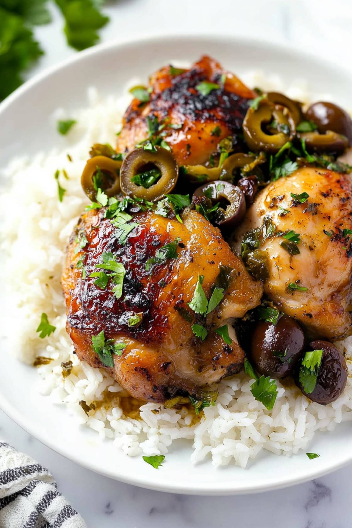 Savory homemade chicken Marbella with rice.