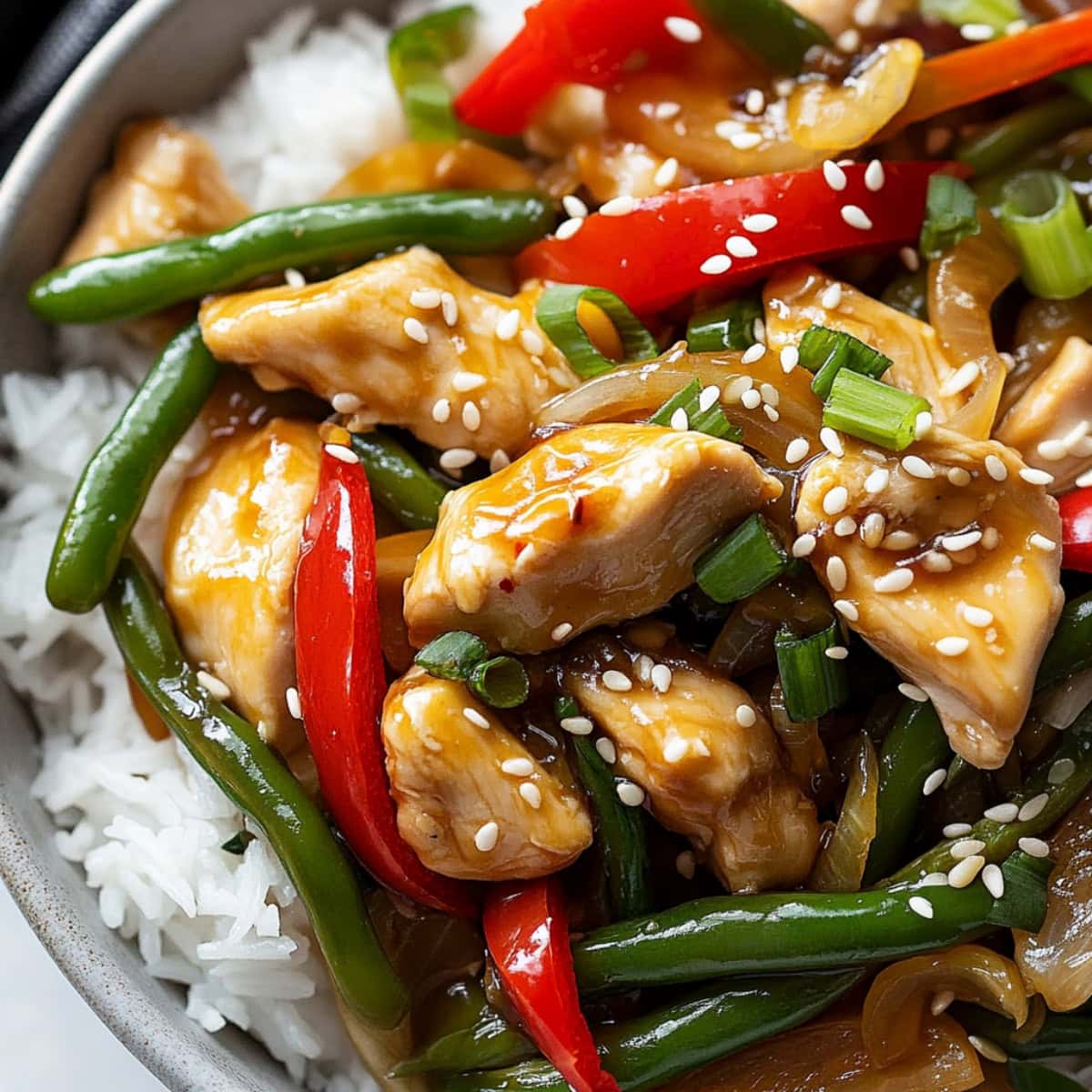 Lemon chicken stir-fry in a bowl, close-up