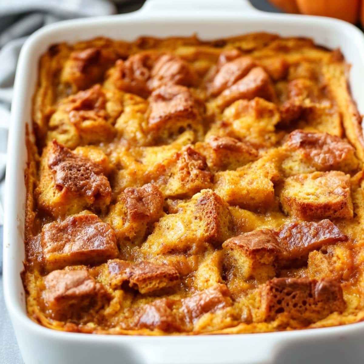 Pumpkin bread pudding in a baking dish.