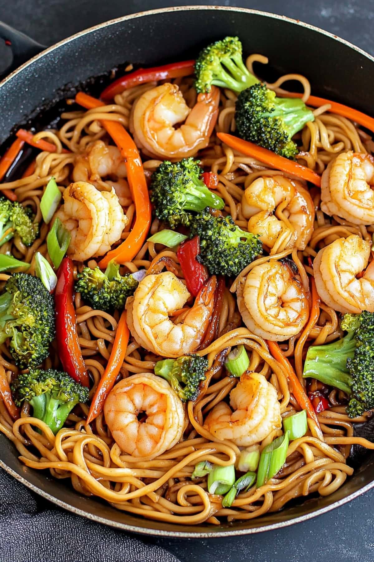 Stir fried shrimp with lo mein noodles.
