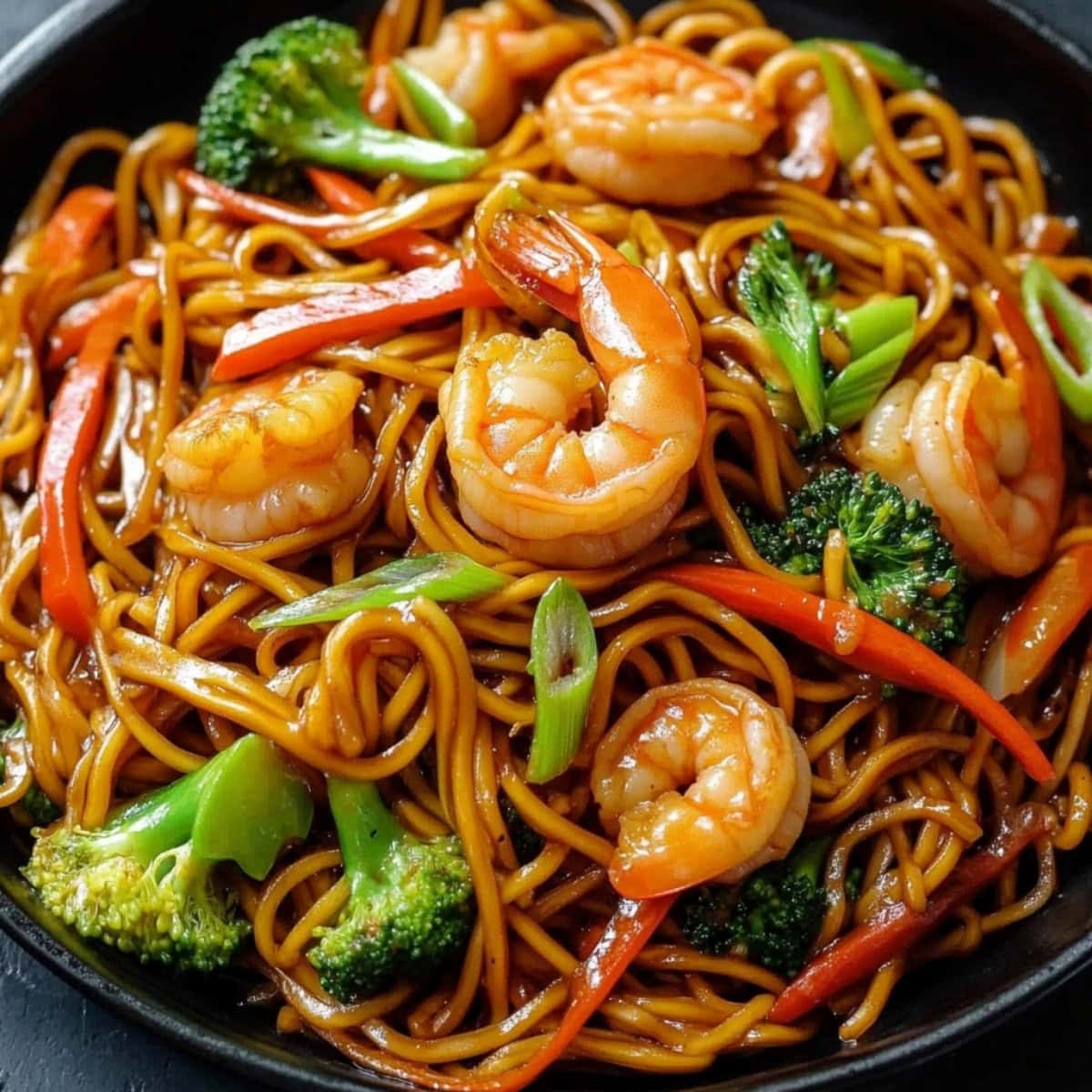 Lo mein noodles, shrimp, carrots, broccoli, scallions and bell peppers, stir fried in hoisin and soy sauce.