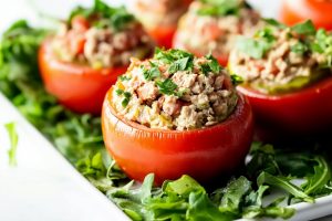 Tuna stuffed potatoes in a pan.