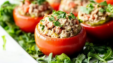 Tuna stuffed potatoes in a pan.