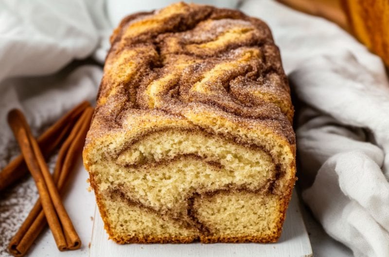 Cinnamon loaf bread in a wooden board.