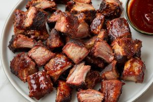 Saucy and savory homemade barbecue rib tips in a plate.