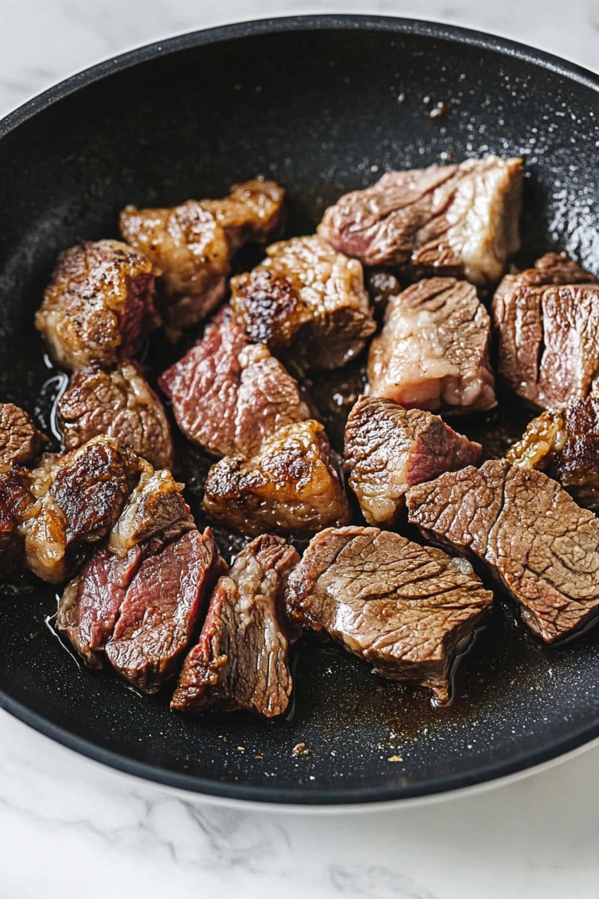 Beef chunk roast in a skillet.