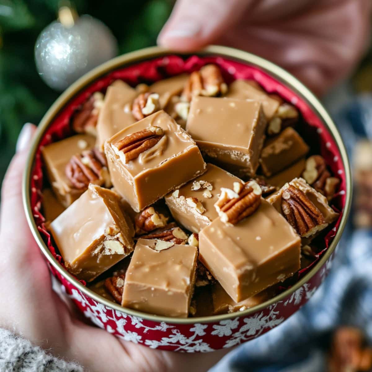 Festive tin filled with Butter Pecan Fudge for Christmas