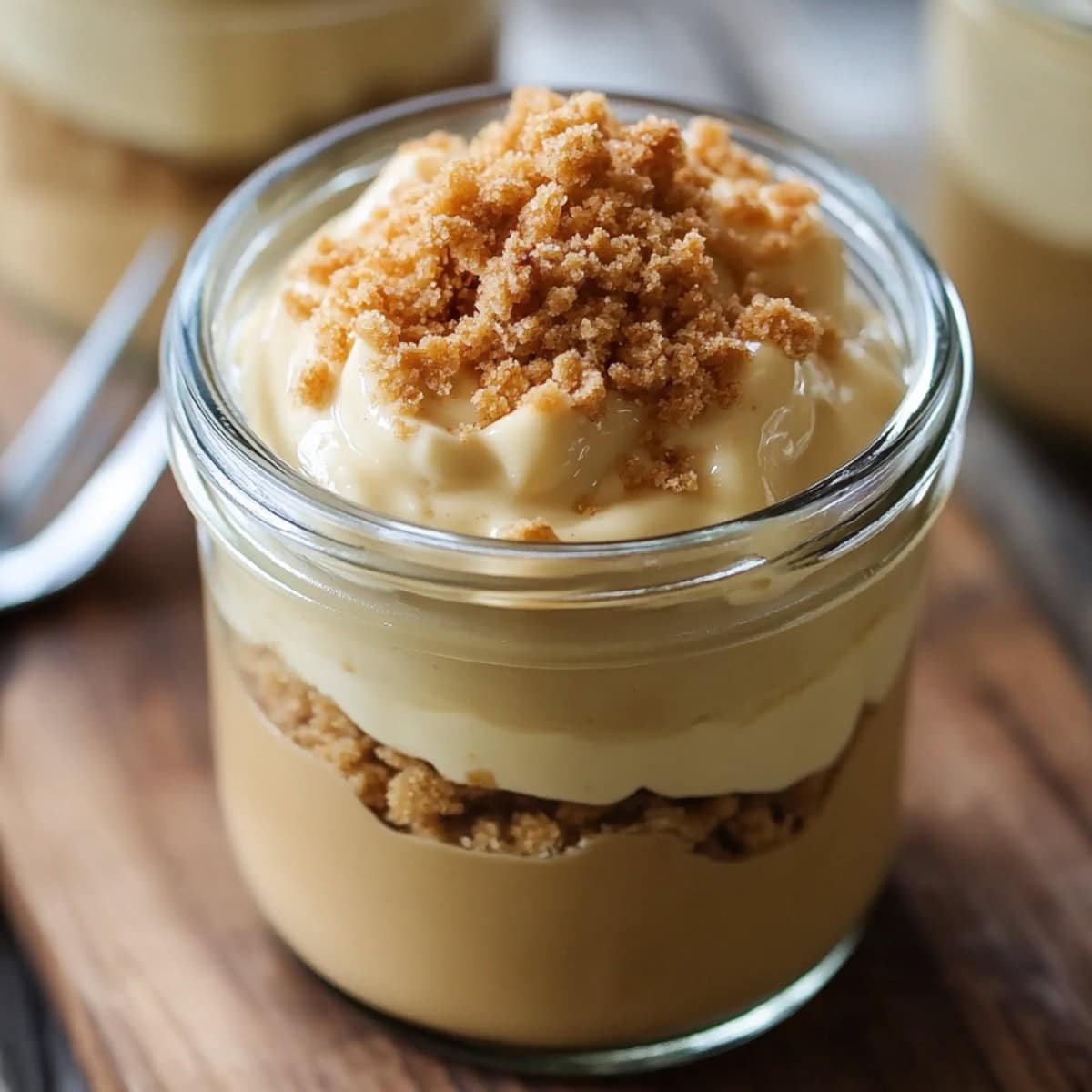 Homemade Butterscotch Pudding in a mason jar with crushed cookies