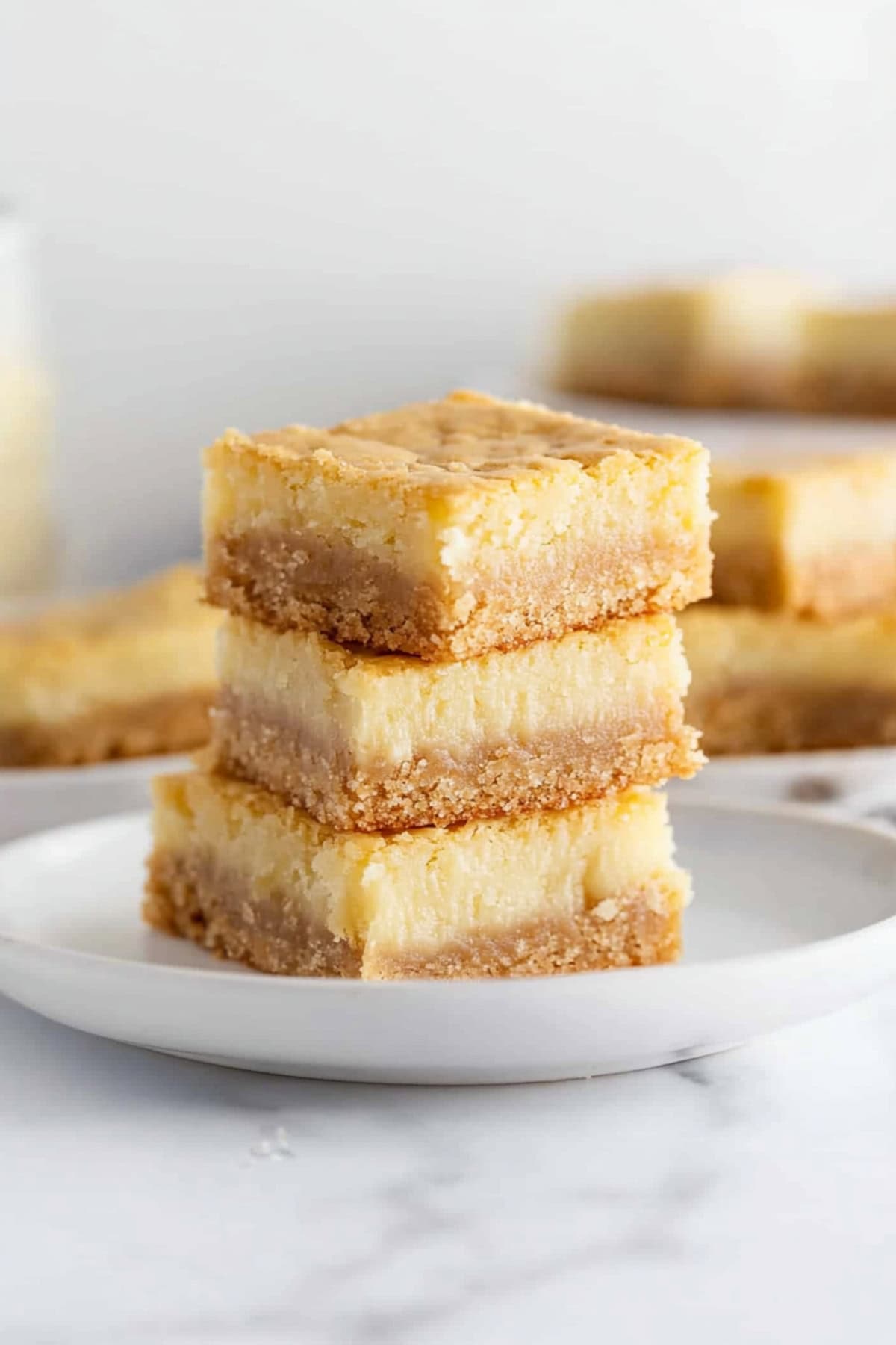 Sweet and buttery chess squares in a white plate.