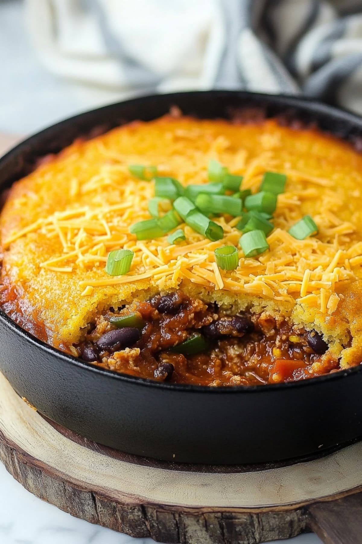 Chili Cornbread Casserole in a Black Skillet