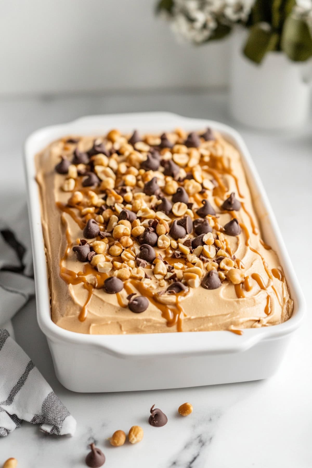 Chocolate Cake with Peanut Butter Frosting in a white baking dish