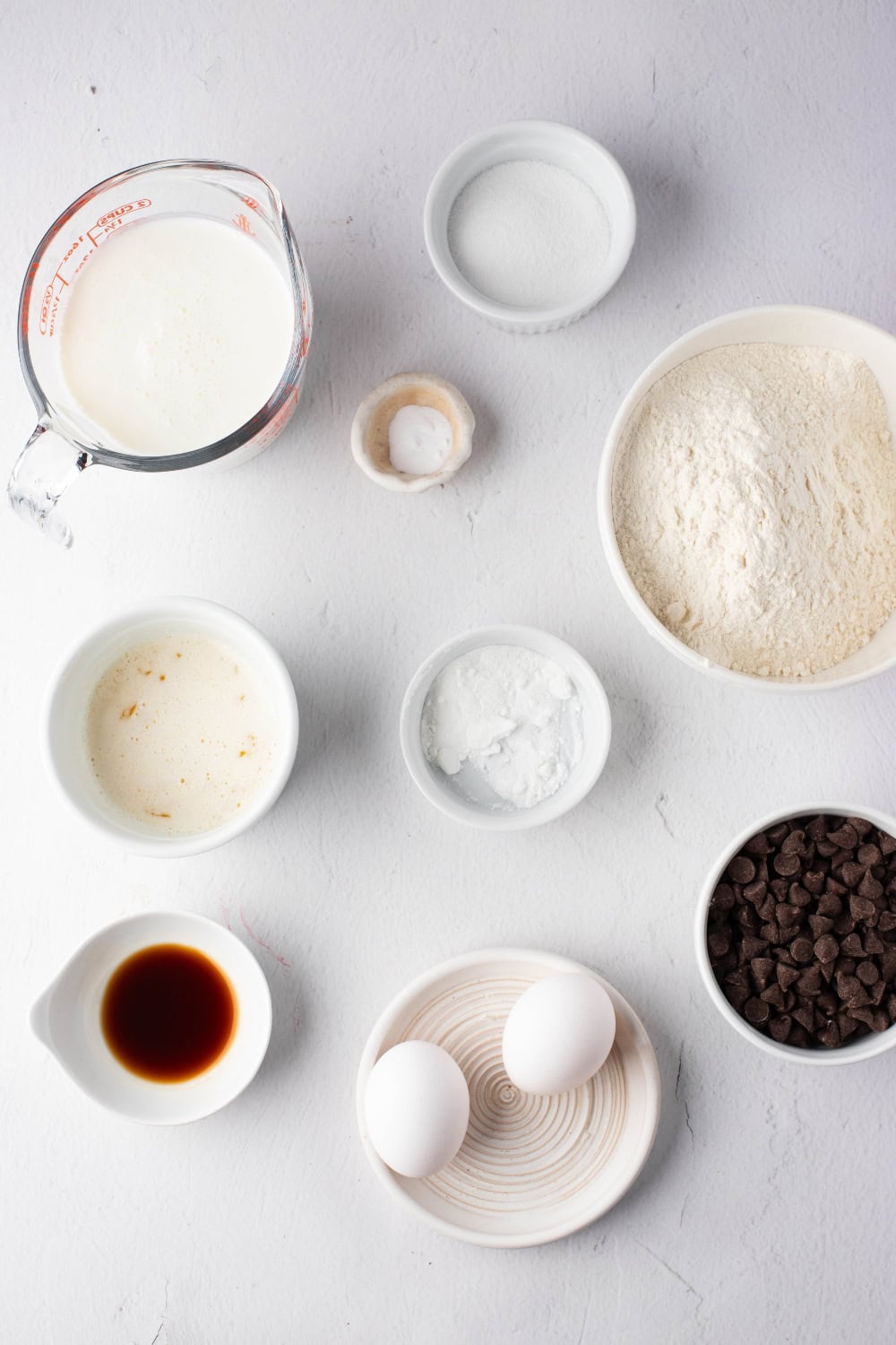 Chocolate Chip Waffle Ingredients - all-purpose flour, sugar, baking powder, baking soda, salt, buttermilk, eggs, butter, vanilla extract, and semi-sweet chocolate chips