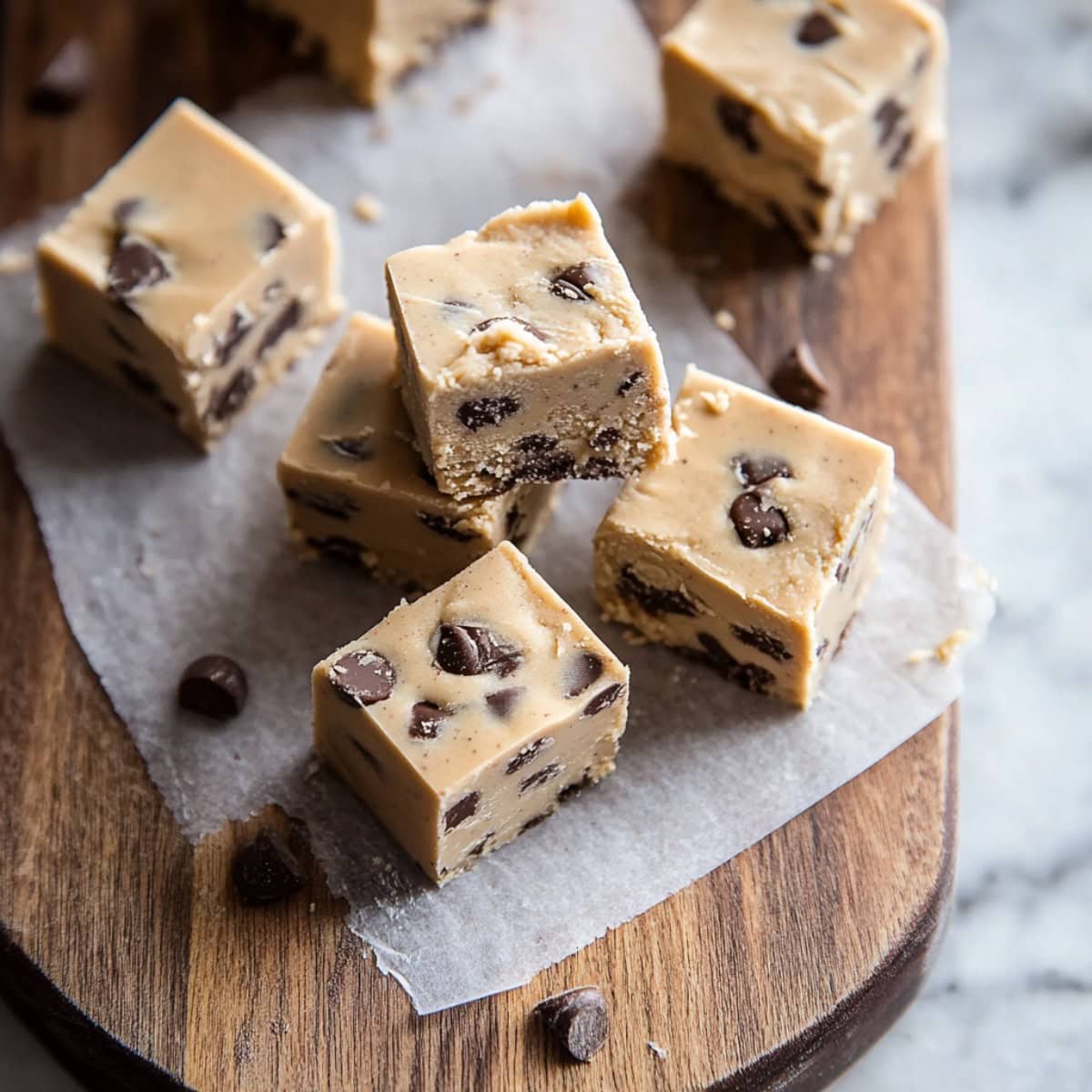 Cookie Dough Fudge Squares on a Chopping Board, top view