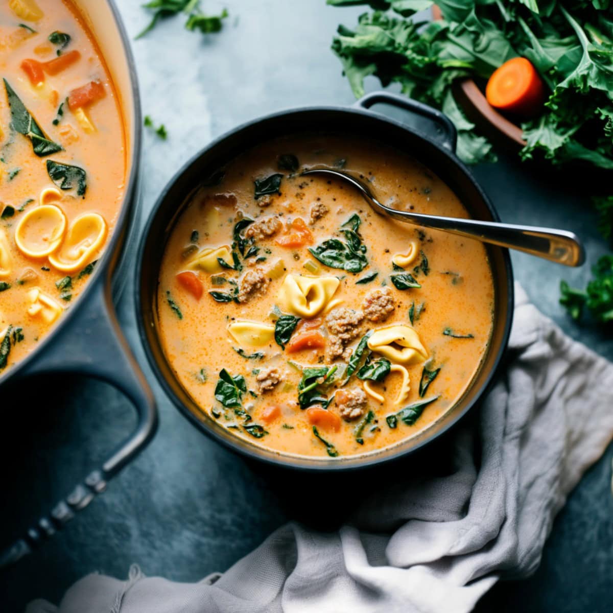 Creamy Sausage Tortellini Soup in a bowl, top view