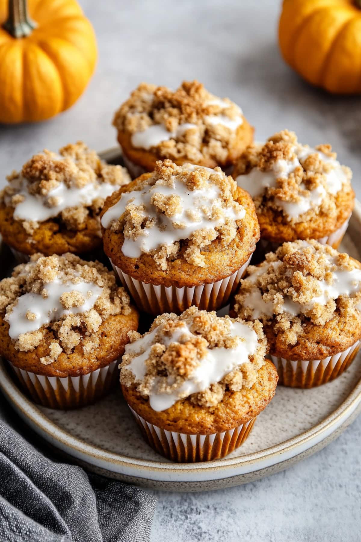 Glazed Pumpkin Streusel Muffins on a Plate