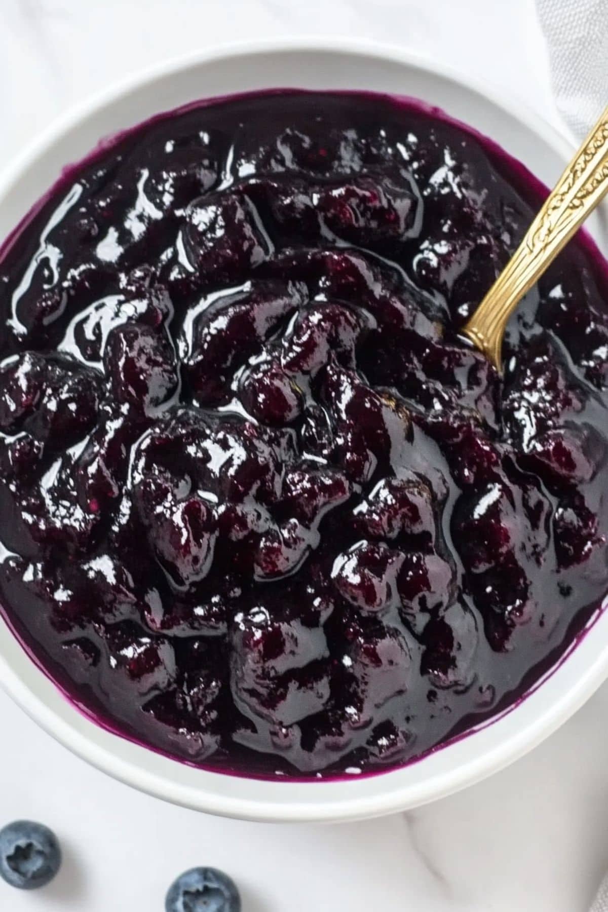 Blueberry filling in a white bowl.