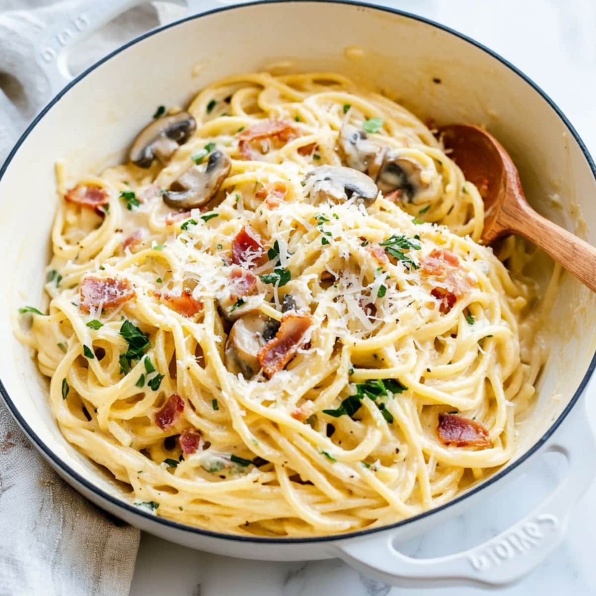 Creamy mushroom carbonara in a skillet pan.