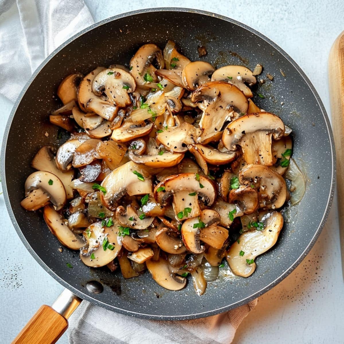 Sauteed mushroom in a skillet pan.