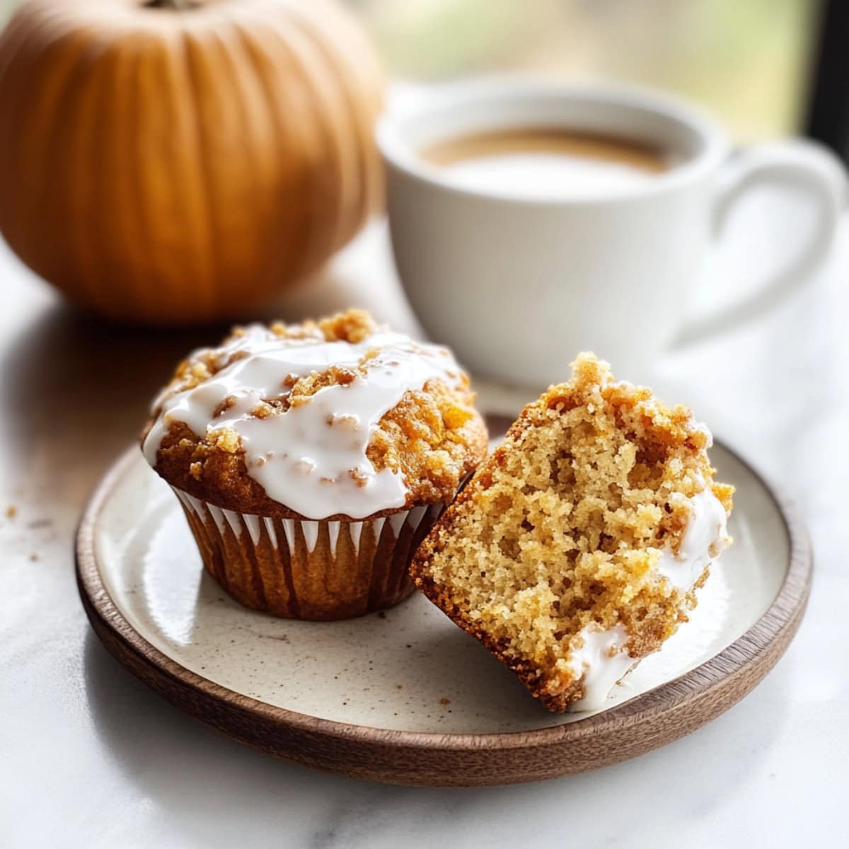 Pumpkin Streusel Muffins on a plate with Coffee