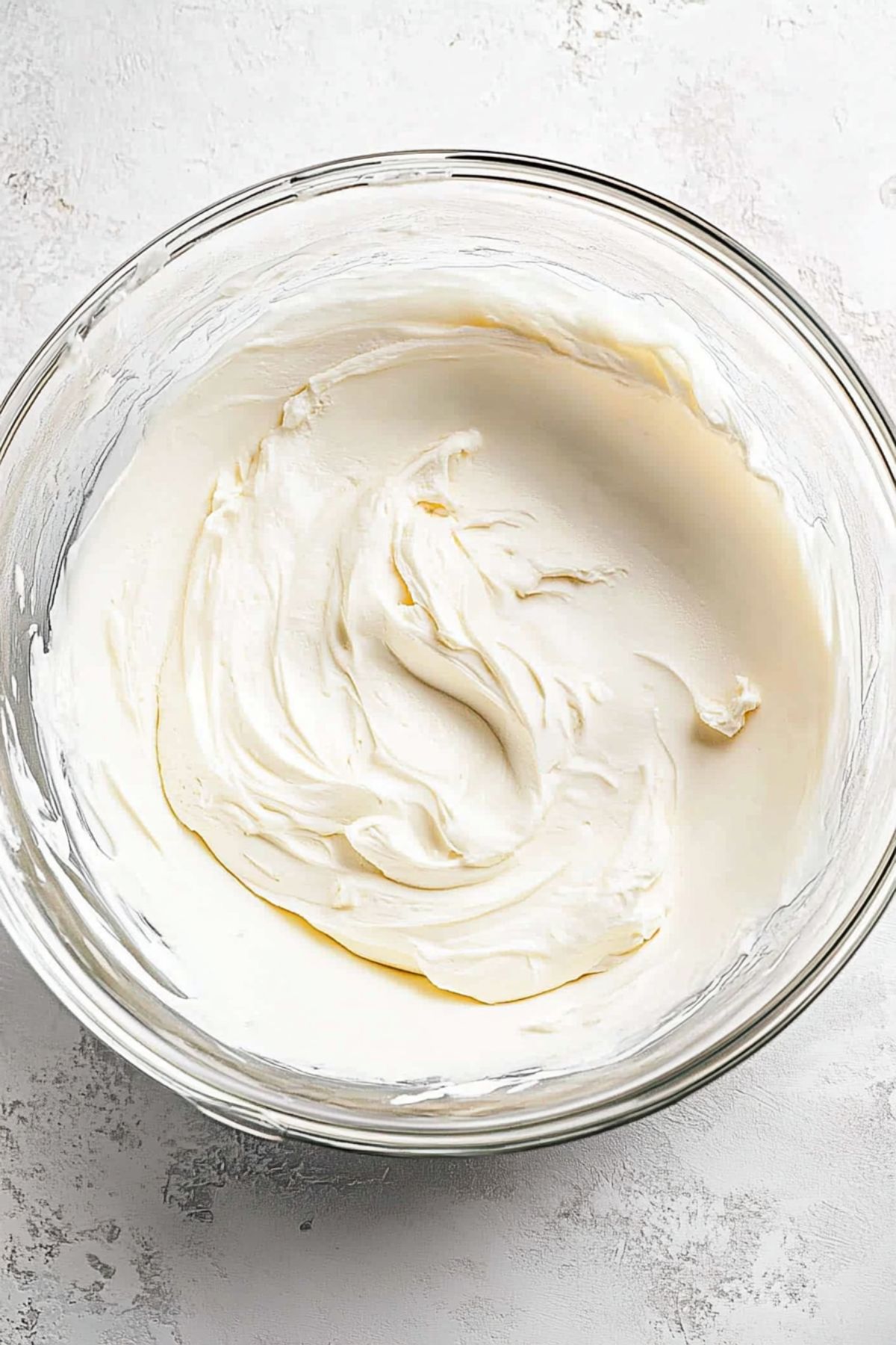 Cream cheese filling on a glass bowl.