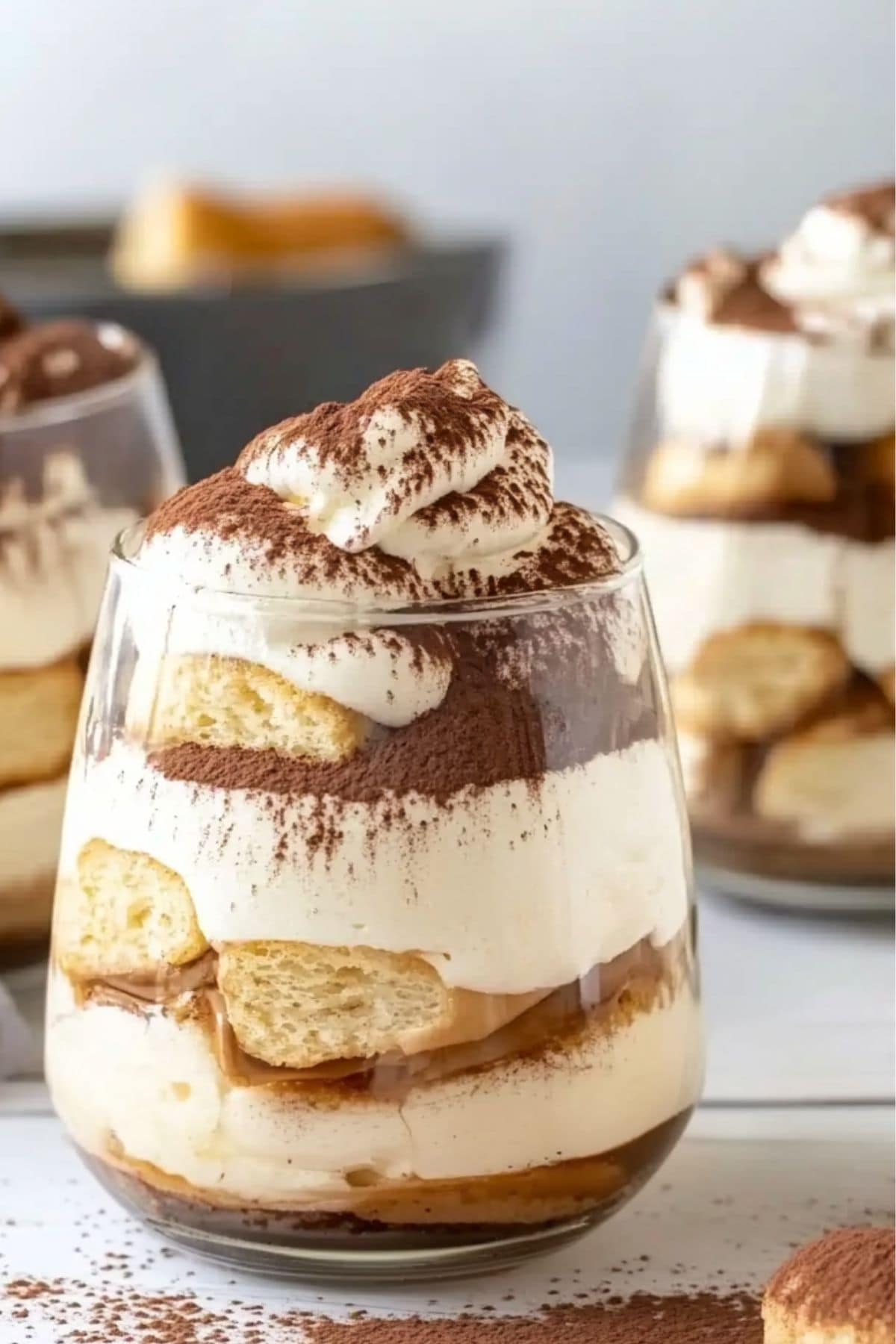 Tiramisu assembled in serving glasses, side view