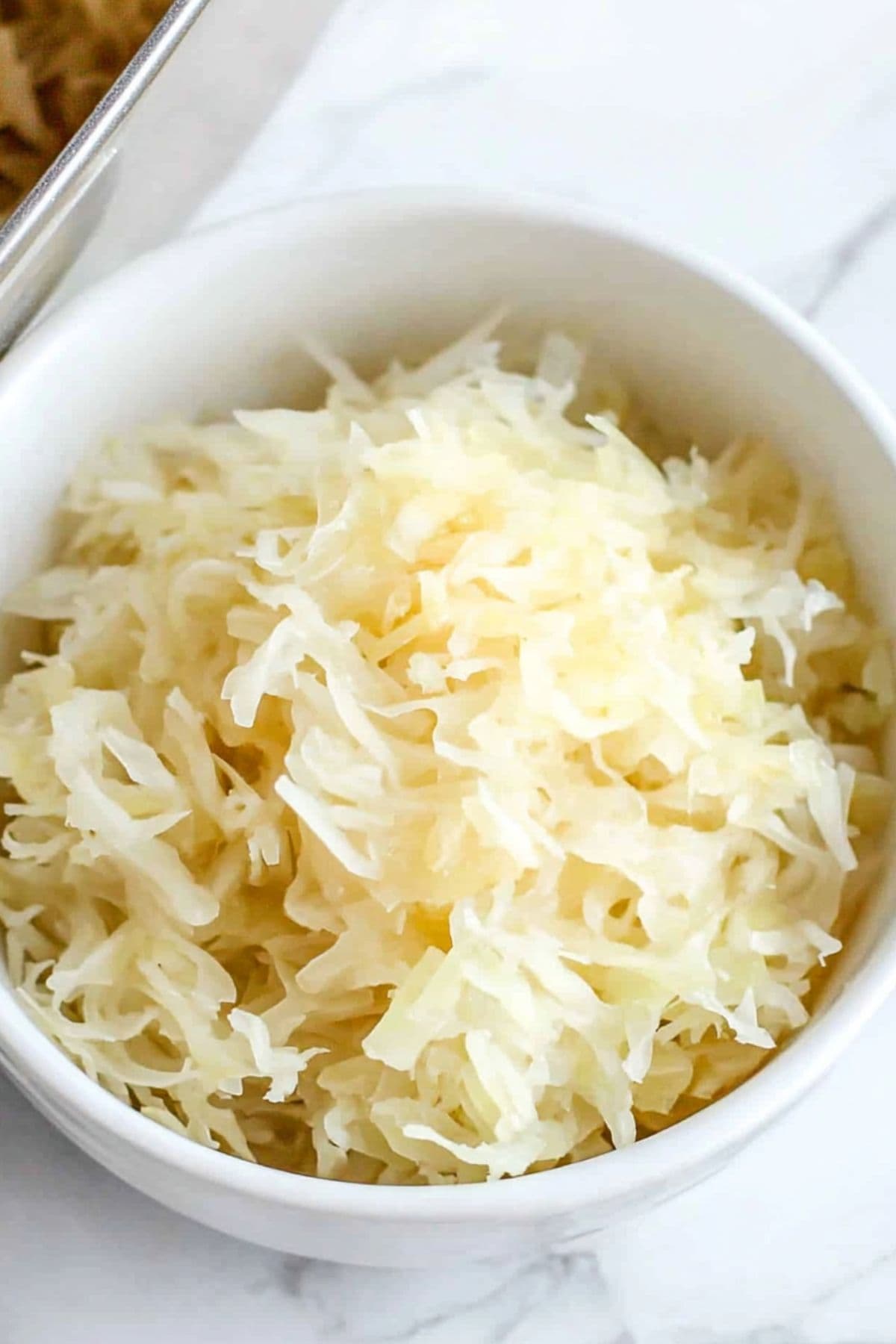 Sauerkraut in a white bowl.