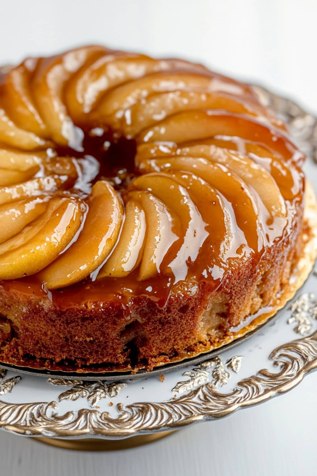 Apple upside down cake on a cake tray, close up