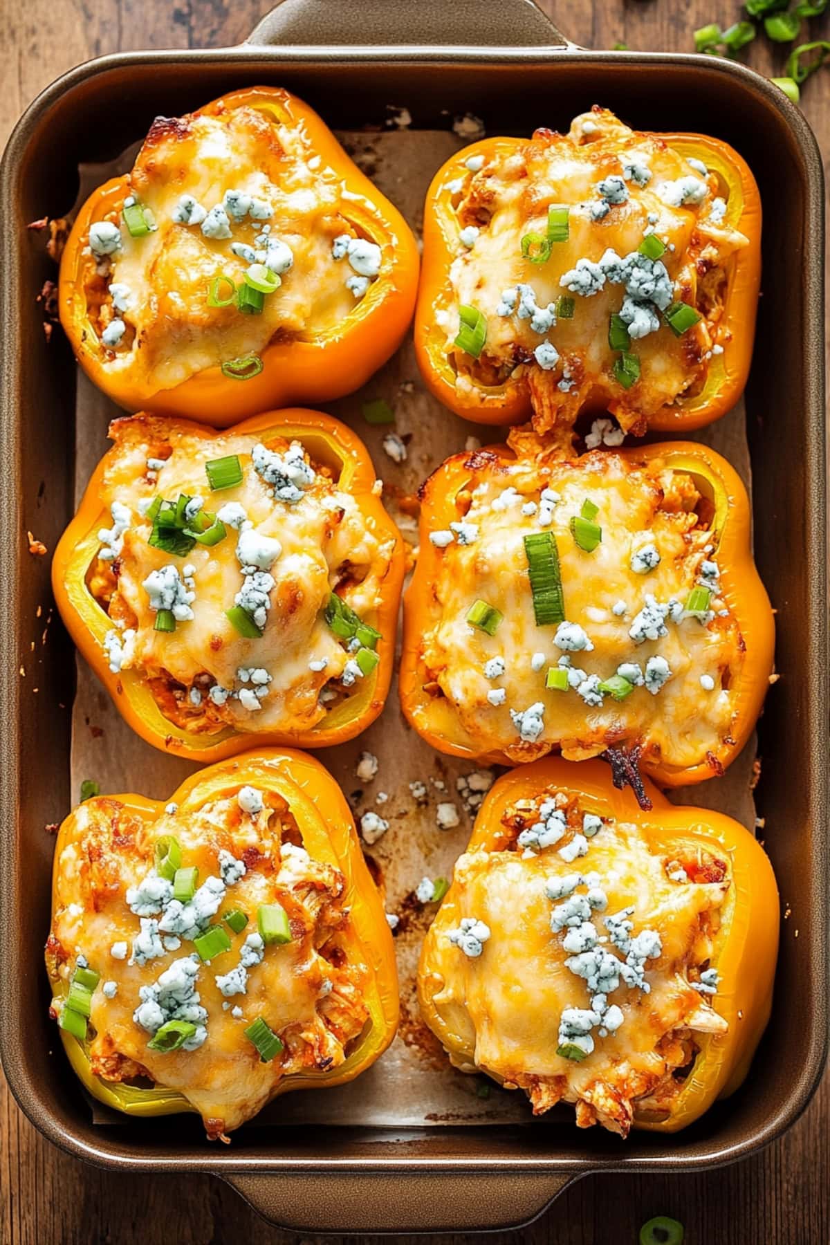 Buffalo chicken stuffed peppers baked in a sheet pan. 