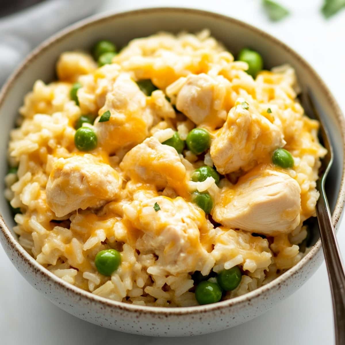 Creamy and mouthwatering homemade chicken and rice in a bowl.