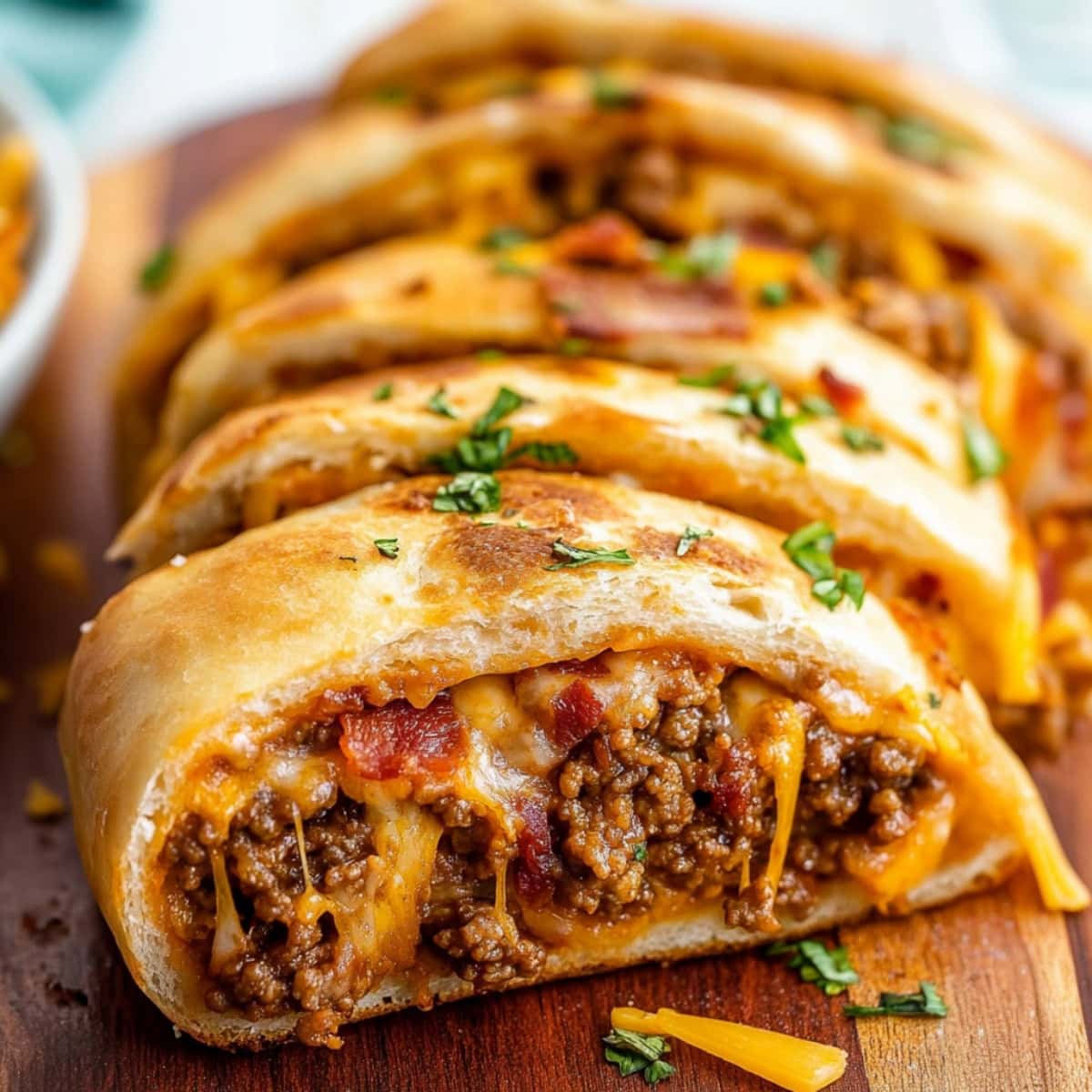  A hearty slice of garbage bread stuffed with various meats, melted cheese and fresh herbs.