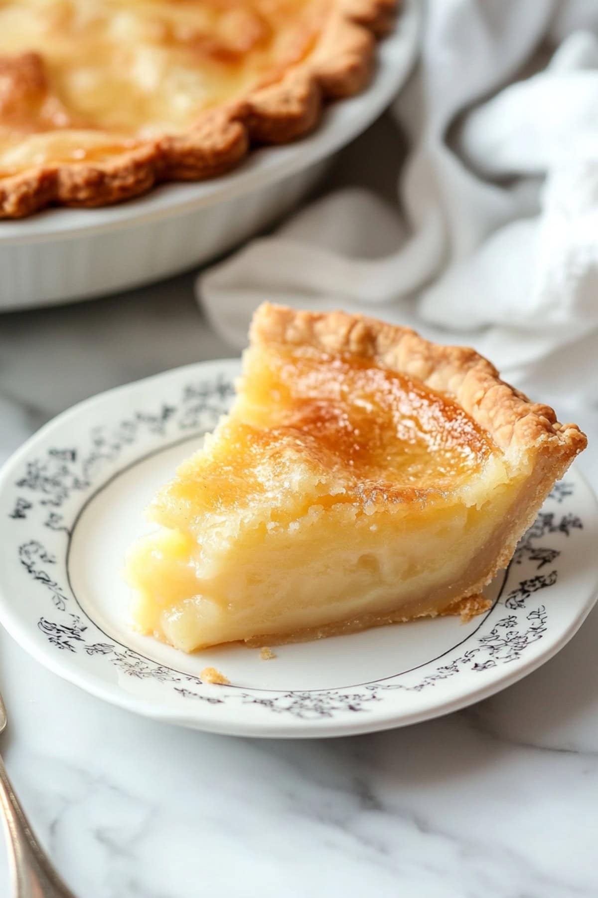 A Piece of Old Fashioned Vinegar Pie on a plate