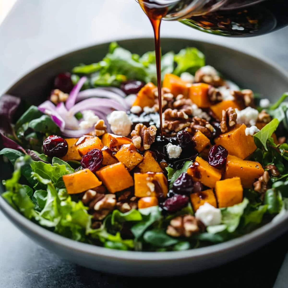 Roasted Butternut Squash Salad drizzled with balsamic dressing